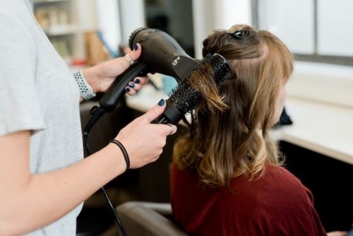 Person getting a blow dry at a hair salon