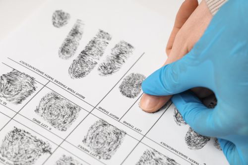 Fingerprints being taken with ink and paper