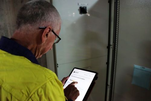 An electrician issuing a certificate of compliance